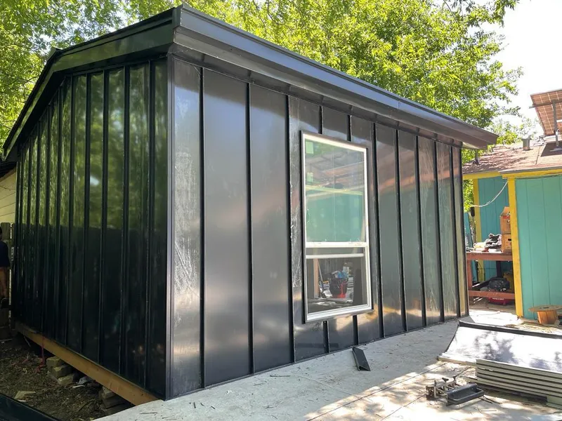 Black standing seam metal wall panels for Roof Inspection in North Londonderry